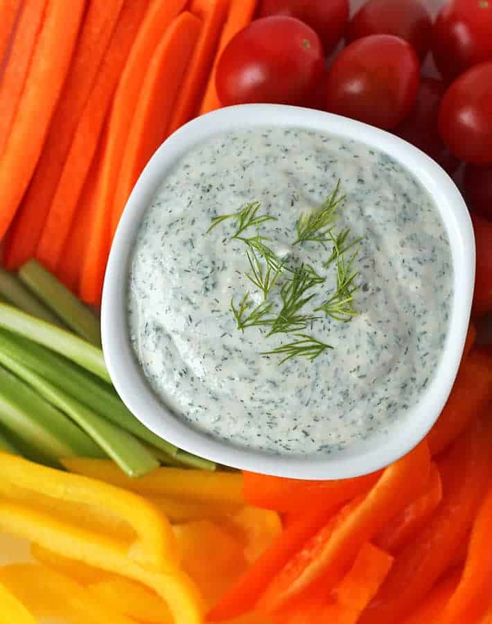 closeup of vegan veggie dip with vegetable dippers on the side