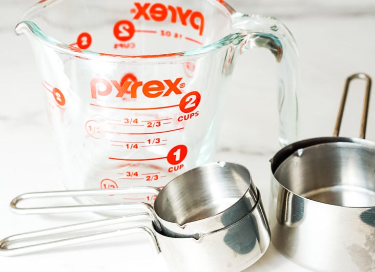 measuring cups on a marble surface