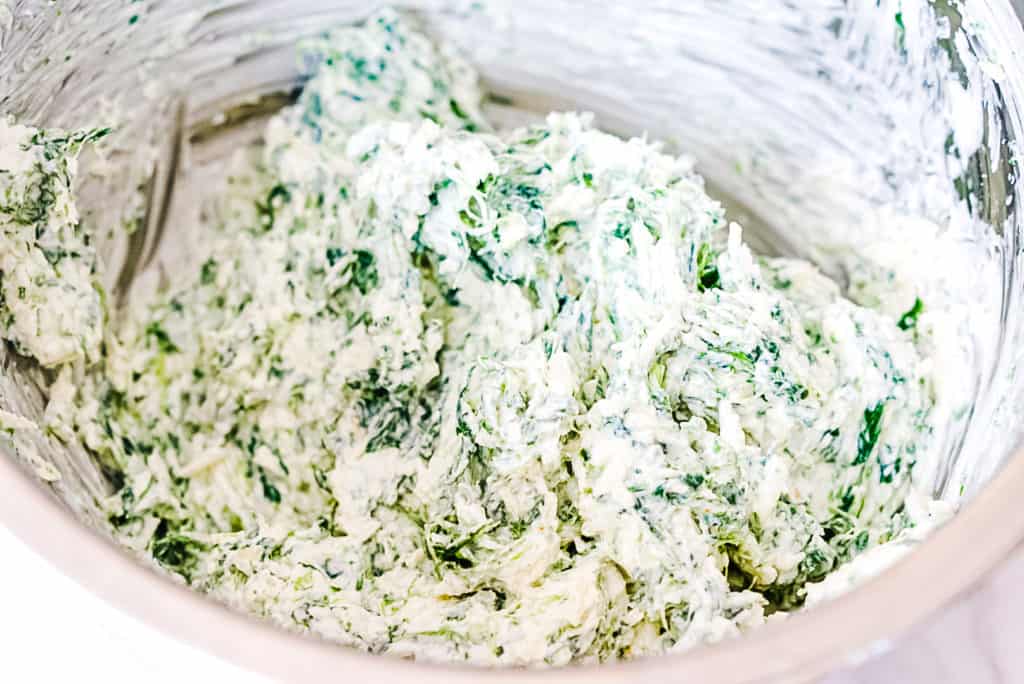 keto spinach dip ingredients well combined in a mixing bowl