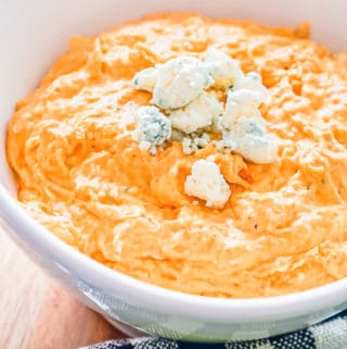 franks red hot buffalo chicken dip with blue cheese crumble garnish
