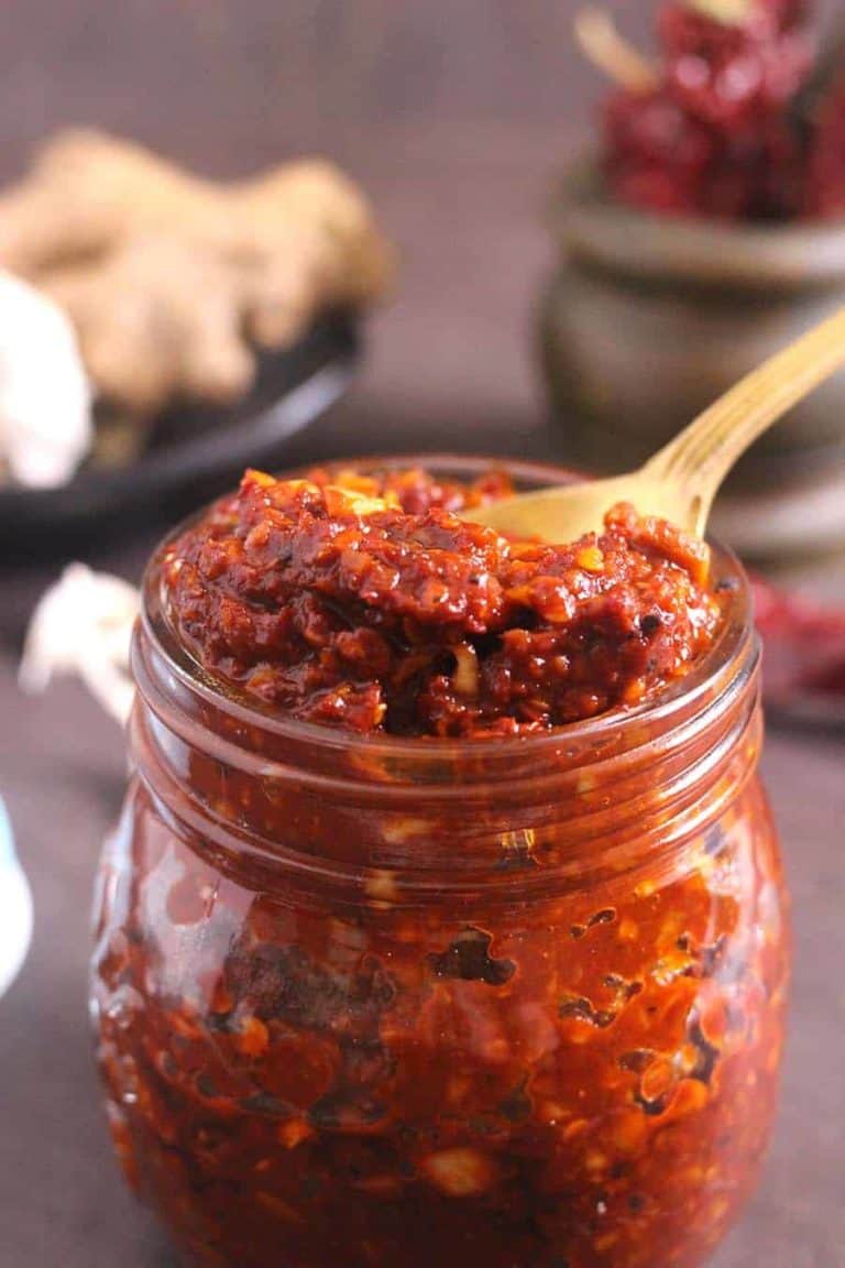 homemade Szechuan Sauce in a jar with a spoon