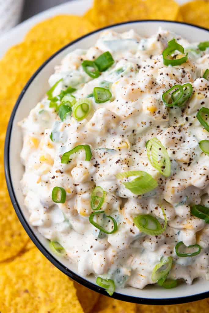 Delicious and easy to make creamy corn dip recipe that is sure to be a crowd pleaser at gatherings, game days, and more! 