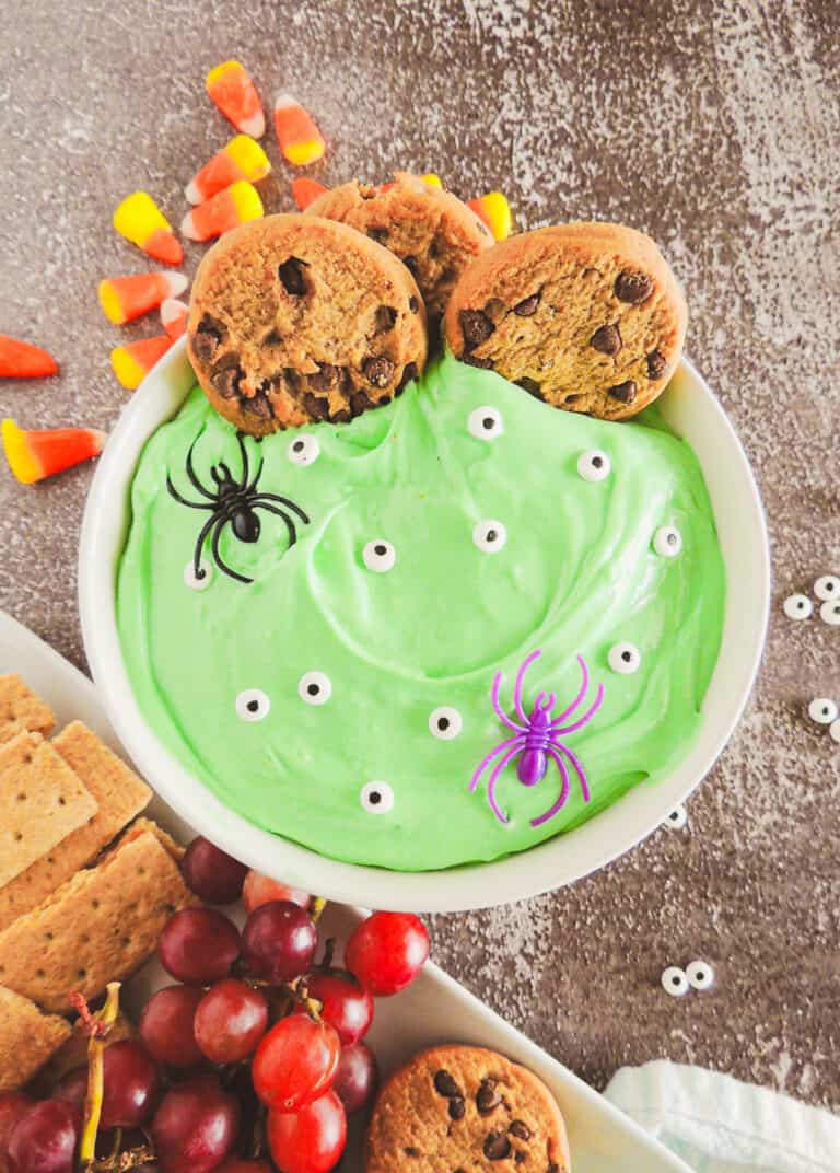 easy halloween dessert dip with green food coloring and candy googly eyes