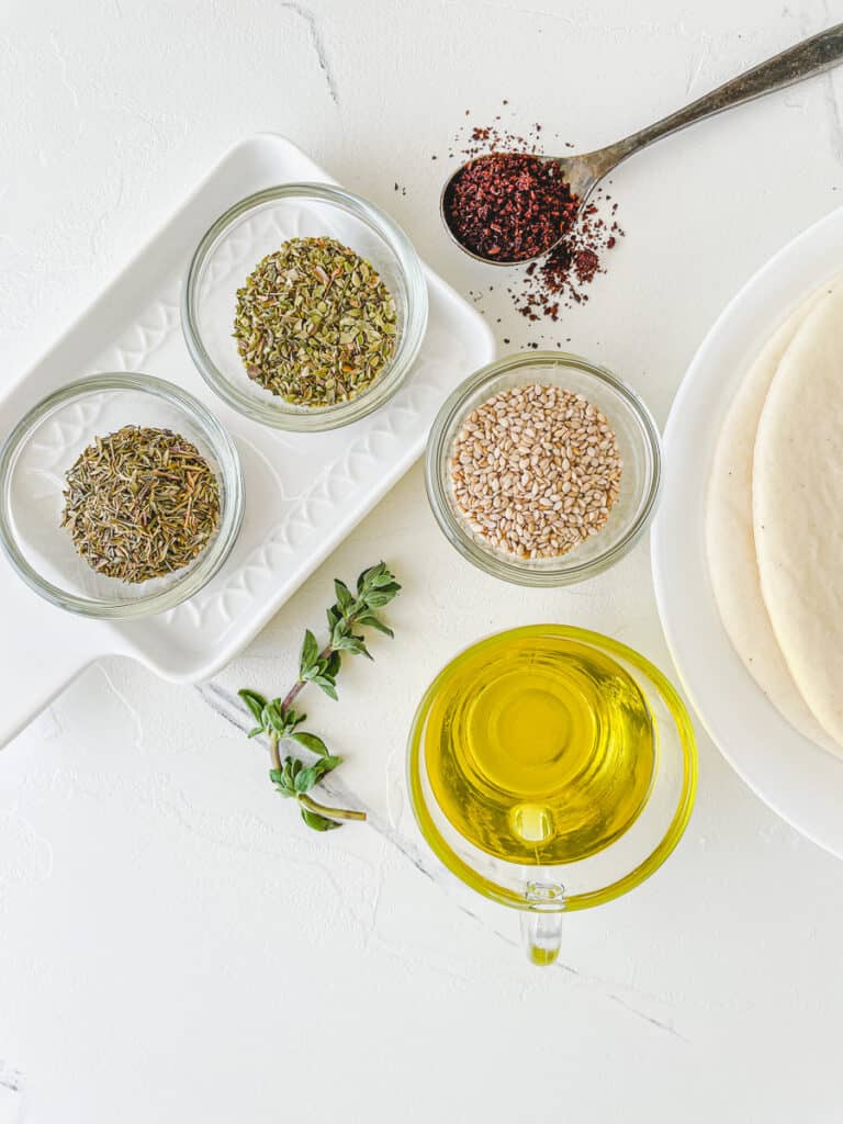 ingredients on a table for how to make zaatar pita chips
