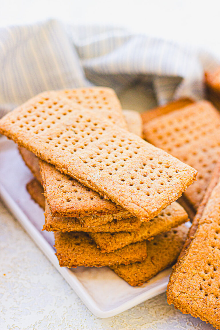 homemade graham crackers stacked on a plate