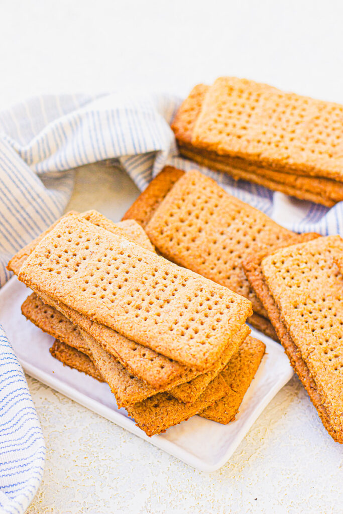 homemade graham cracker recipe with crackers stacked on a table