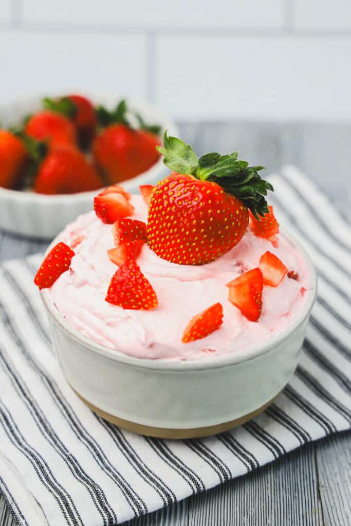 prepared strawberry dip in a bowl with fresh strawberries
