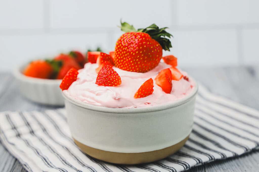 prepared strawberry fruit dip made with whipped topping, cream cheese, and fresh strawberries