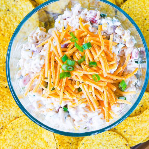 prepared corn dip with Rotel surrounded by tortilla chips