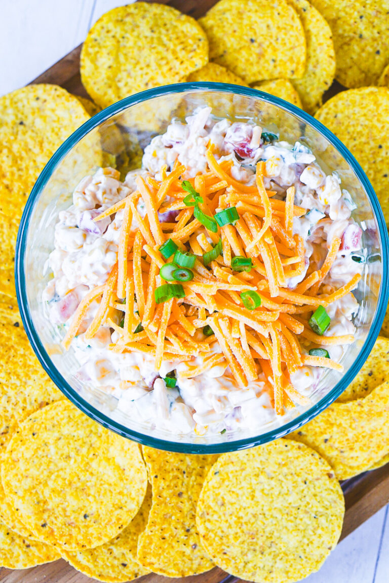 prepared corn dip with Rotel surrounded by tortilla chips