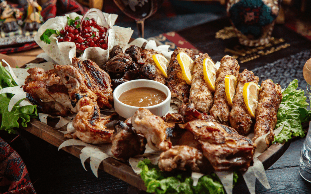 Mixed grilled meats platter with lemonMixed grilled meats platter with lemon and sauceMixed grilled meats platter with lemon and sauce and sauce