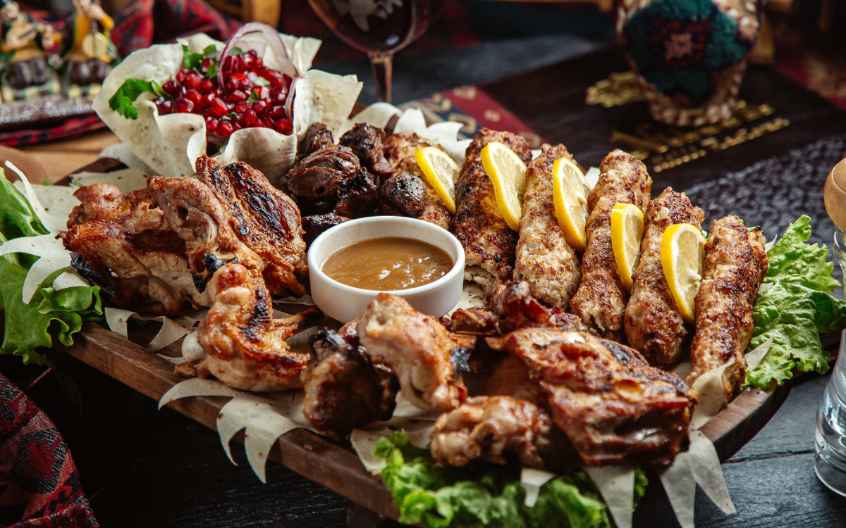 Mixed grilled meats platter with lemonMixed grilled meats platter with lemon and sauceMixed grilled meats platter with lemon and sauce and sauce