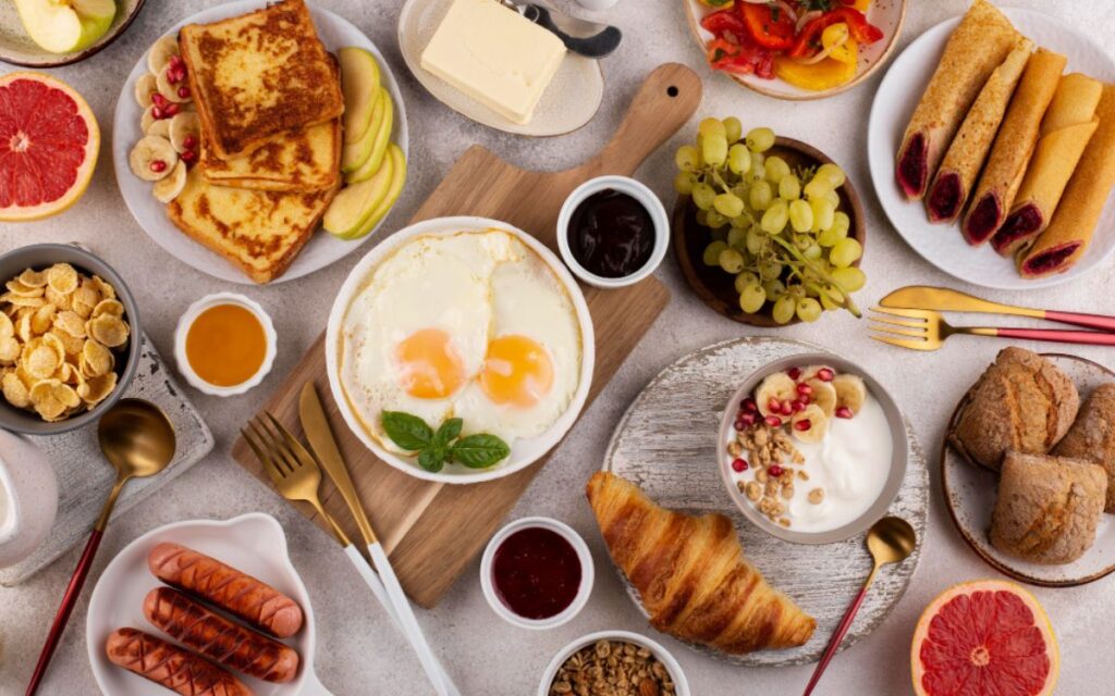 Flat lay table full of delicious food composition