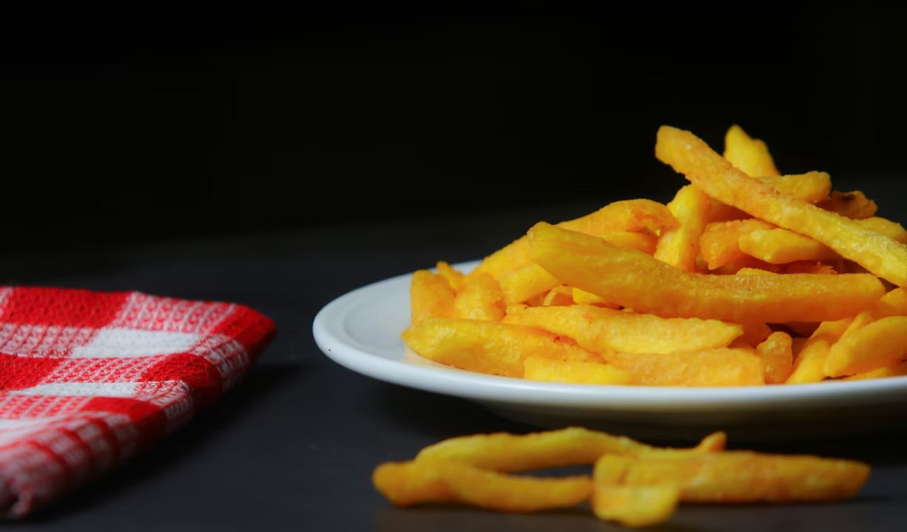 A plate of French fries on a table