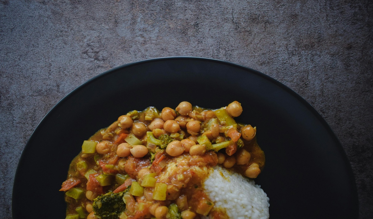 Tasty rice with stewed vegetables on plate