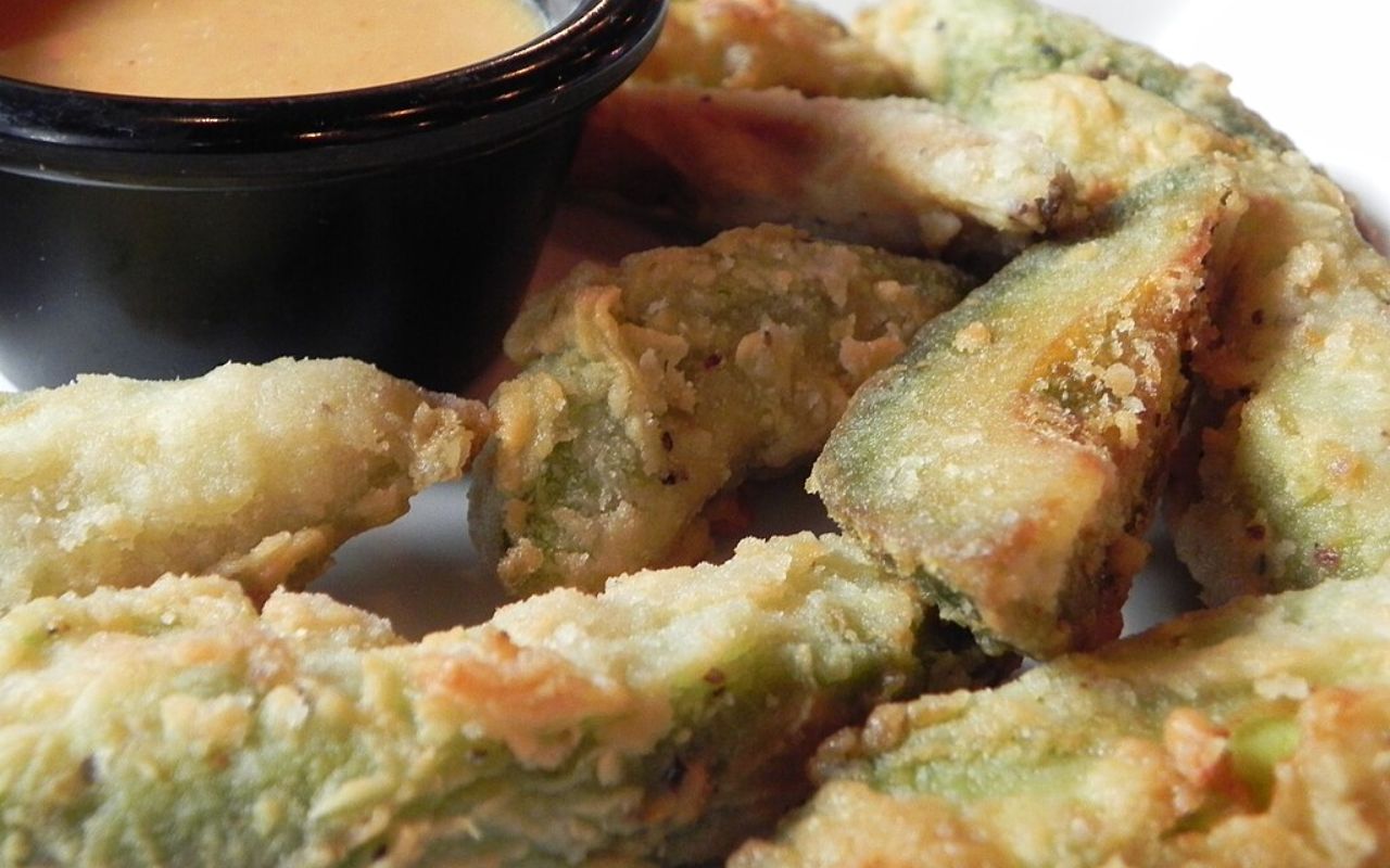 Crispy fried avocado slices served with dipping sauce