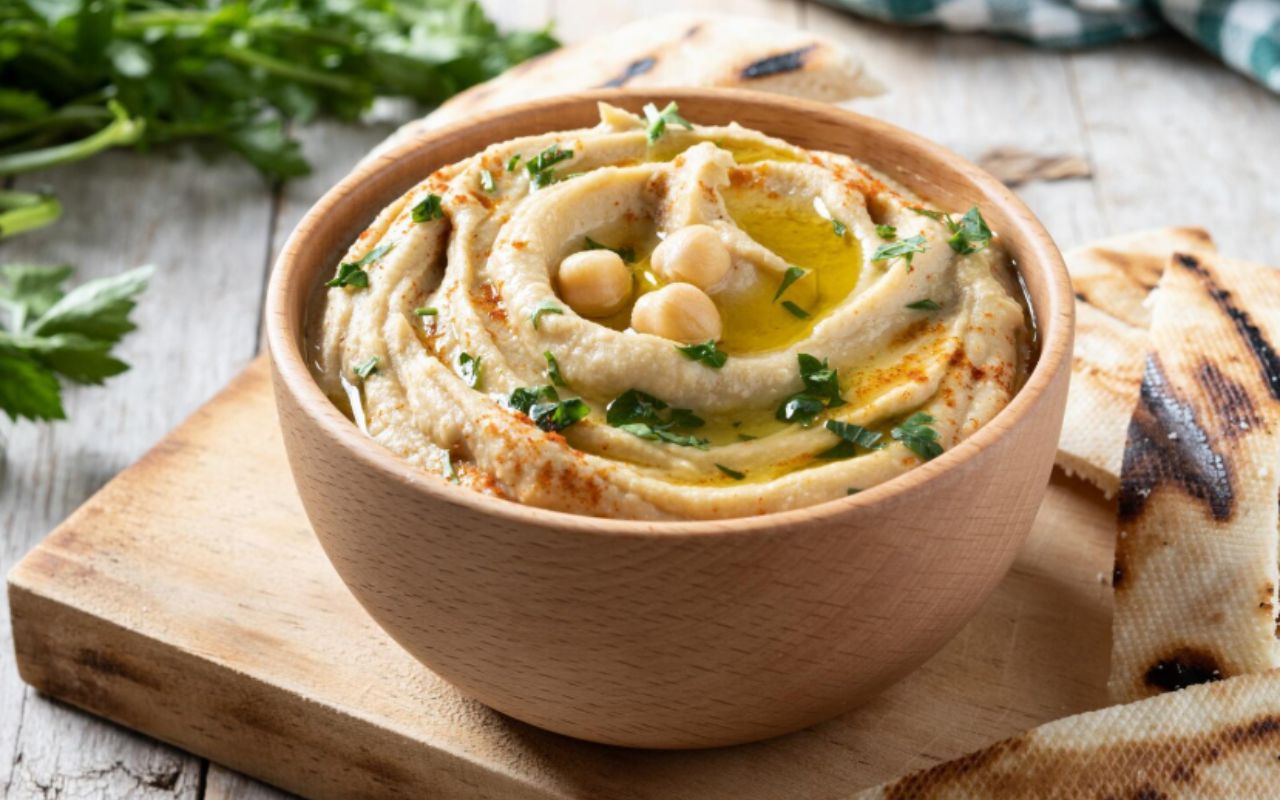 Chickpea hummus on a rustic wooden table
