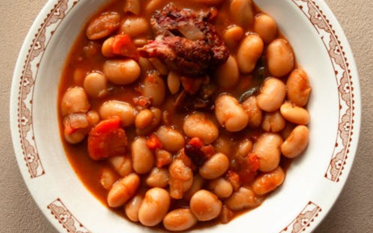 Bowl of baked beans in sauce