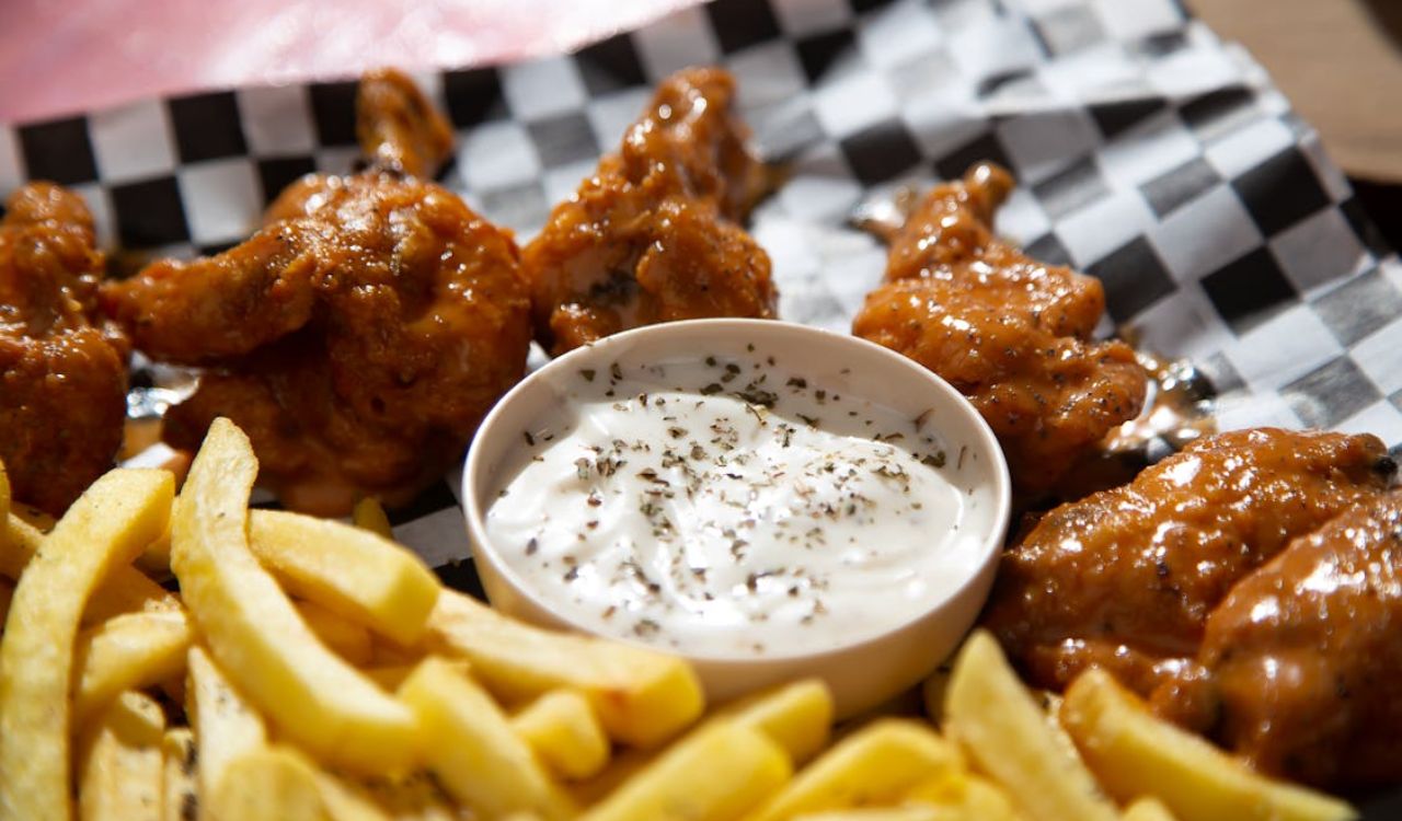 Close-up Photo of French Fries and Fried Chicken Wings