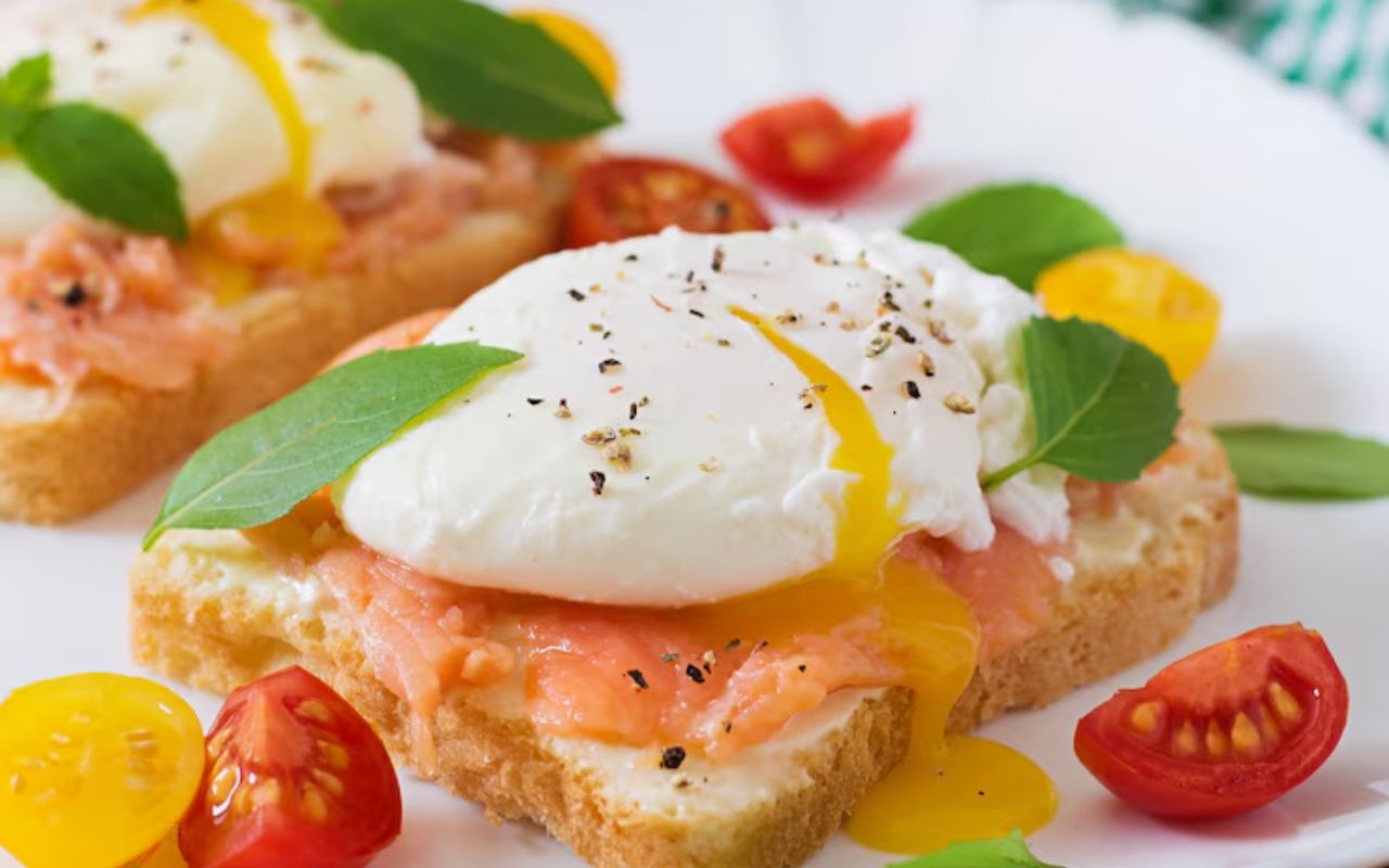 Caprese eggs Benedict with basil and tomatoes