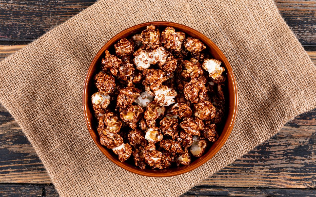 Chocolate-coated popcorn in a brown bowl