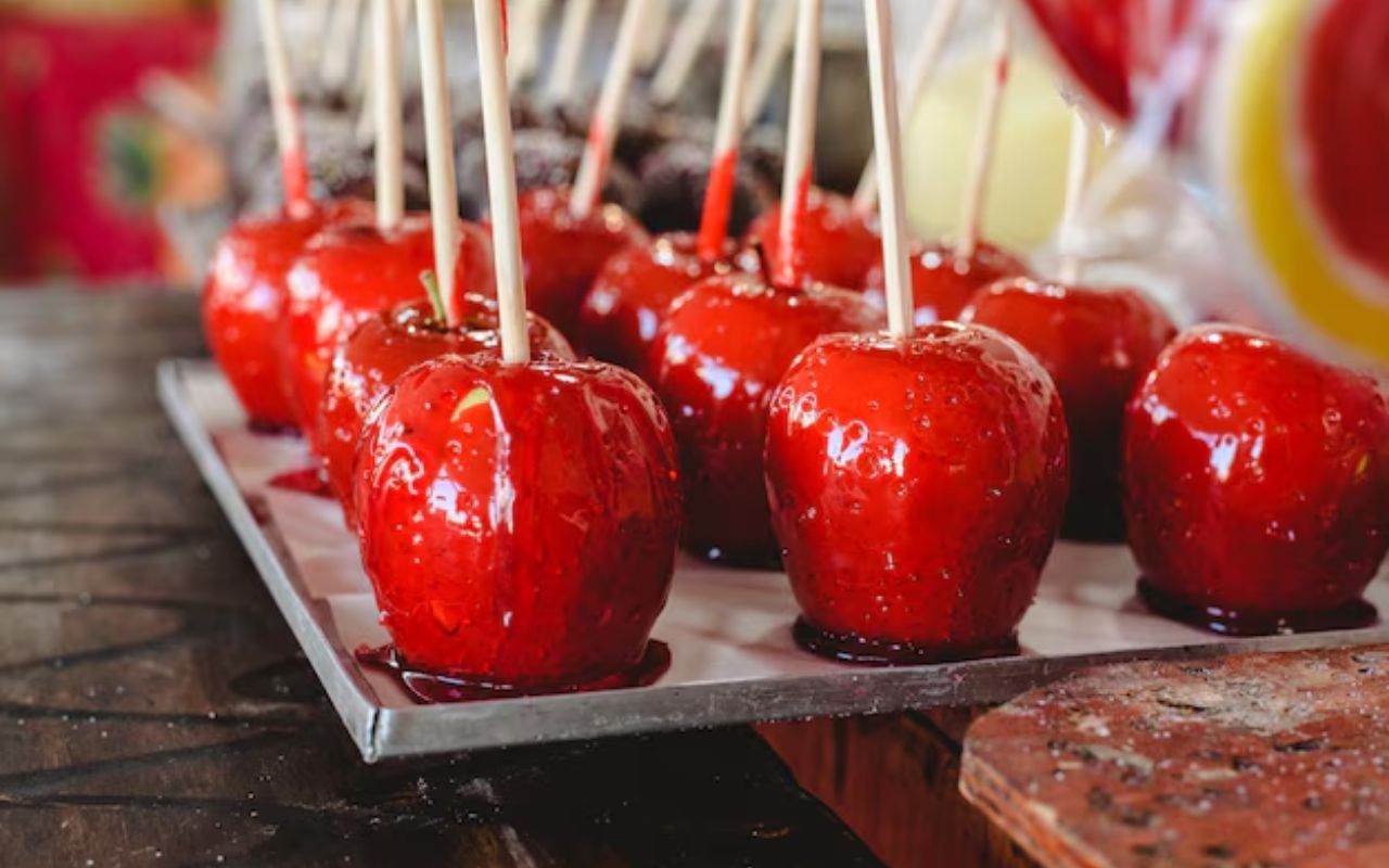Shiny red candy apples on sticks