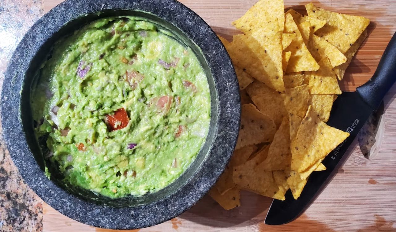 Creamy and flavorful guacamole filled with tomatoes and chillis