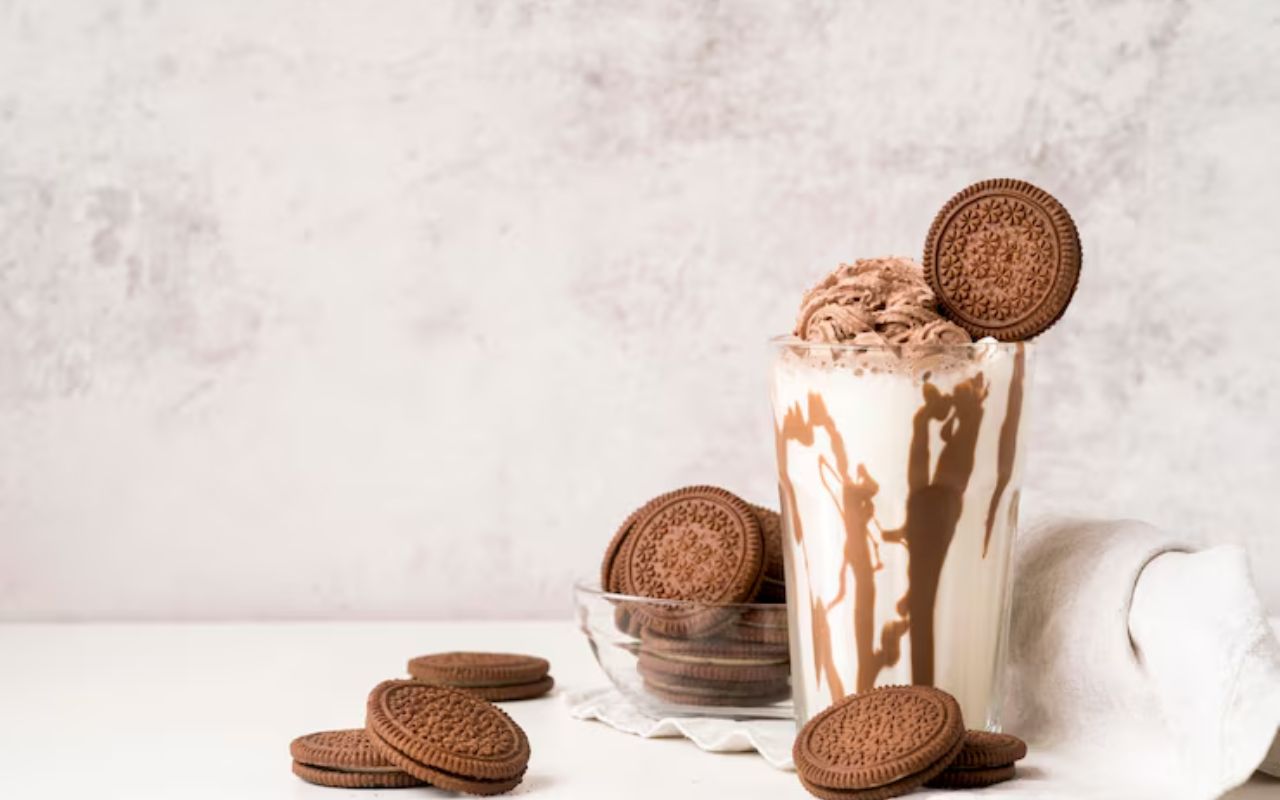 Cookies and cream milkshake topped with whipped cream and cookies