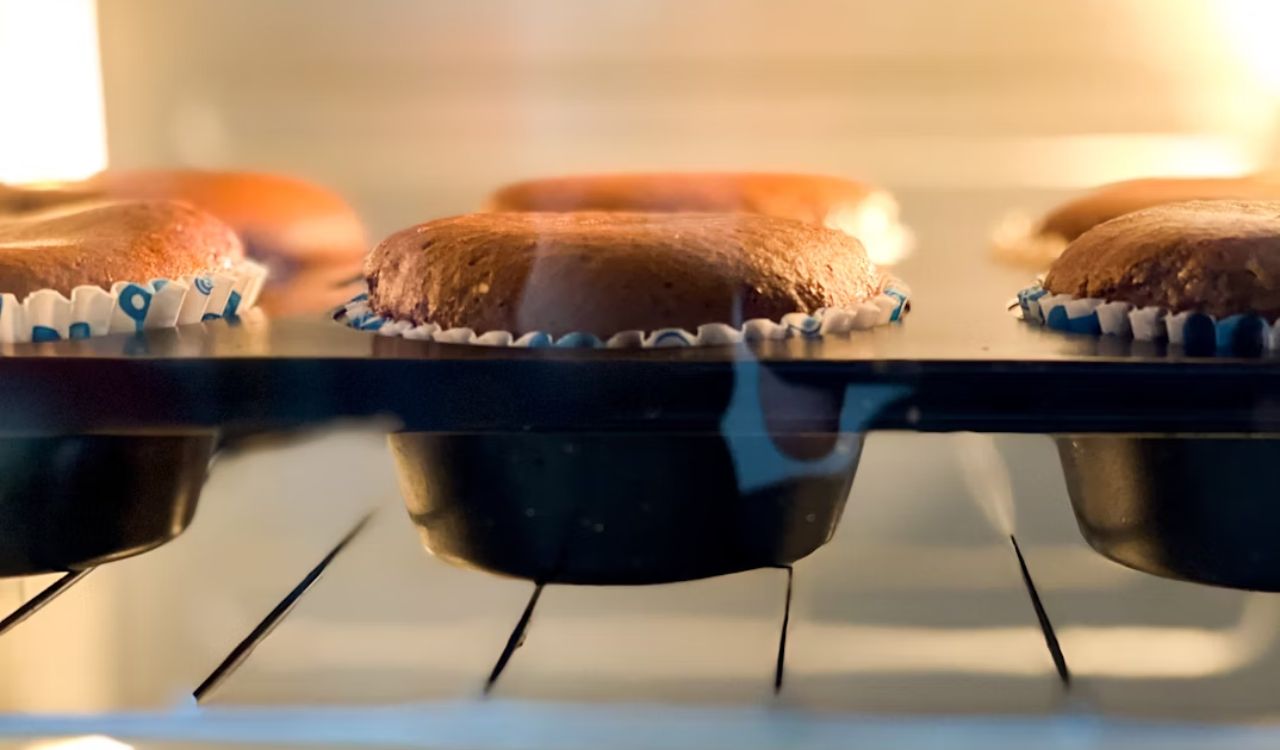 Cupcake baking in oven