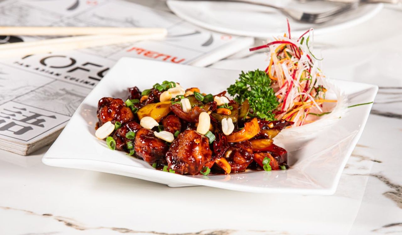 Delicious Kung Pao chicken on white plate