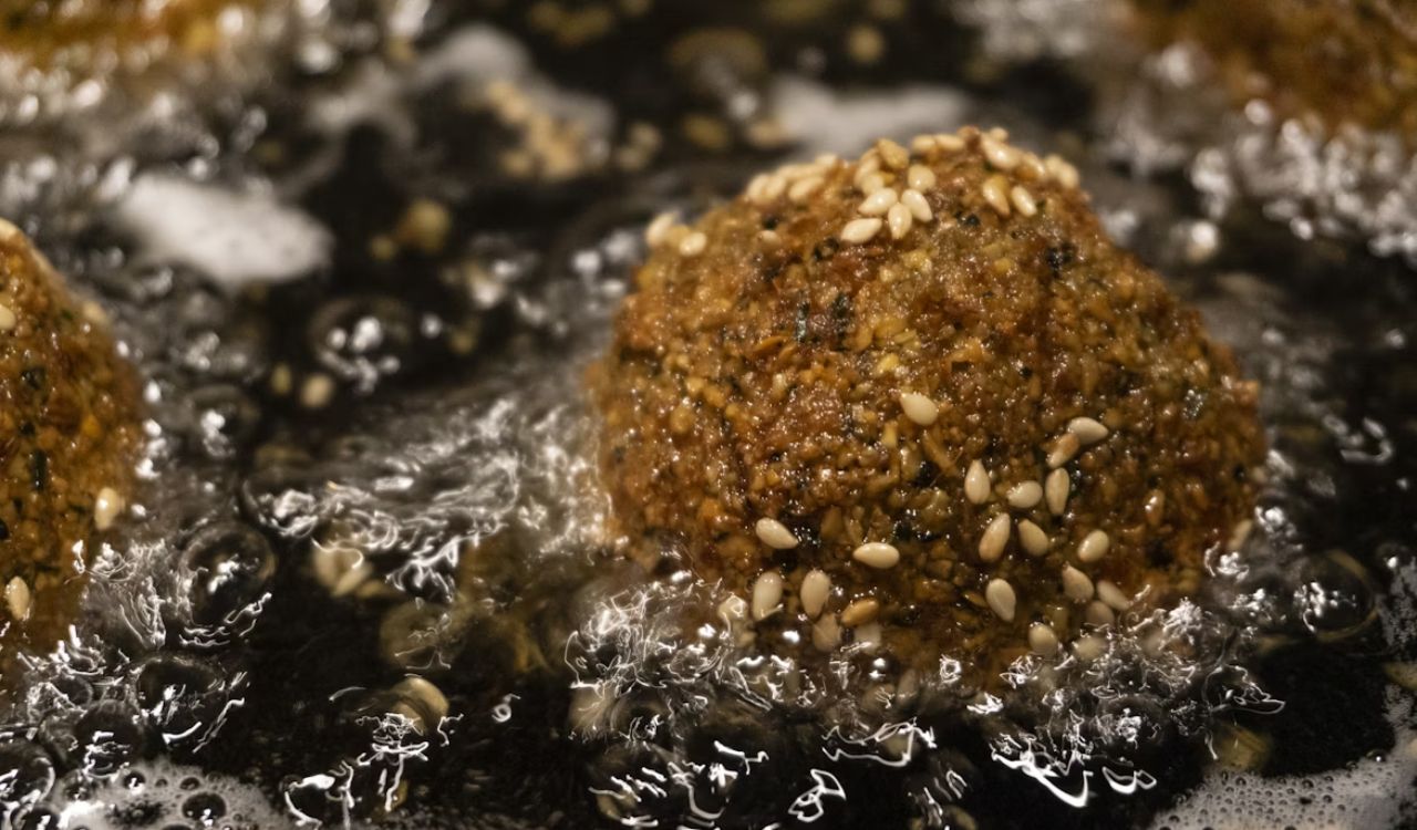 Fried meatballs with sesame seeds on top