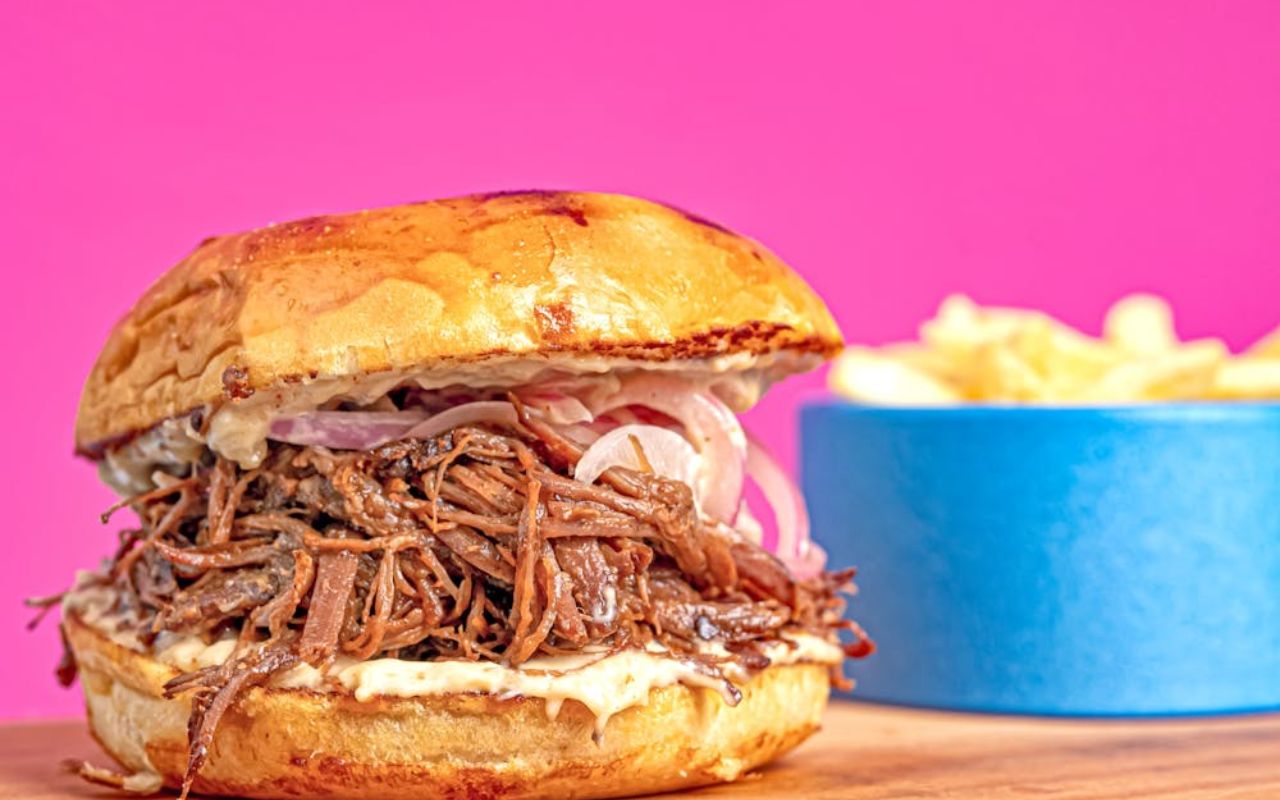 Pulled pork sandwich with pickled onions