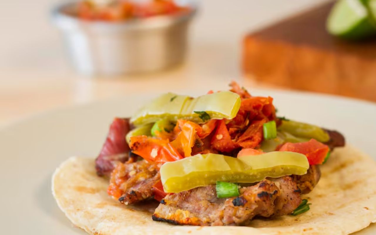 Breakfast taco with grilled meat and peppers