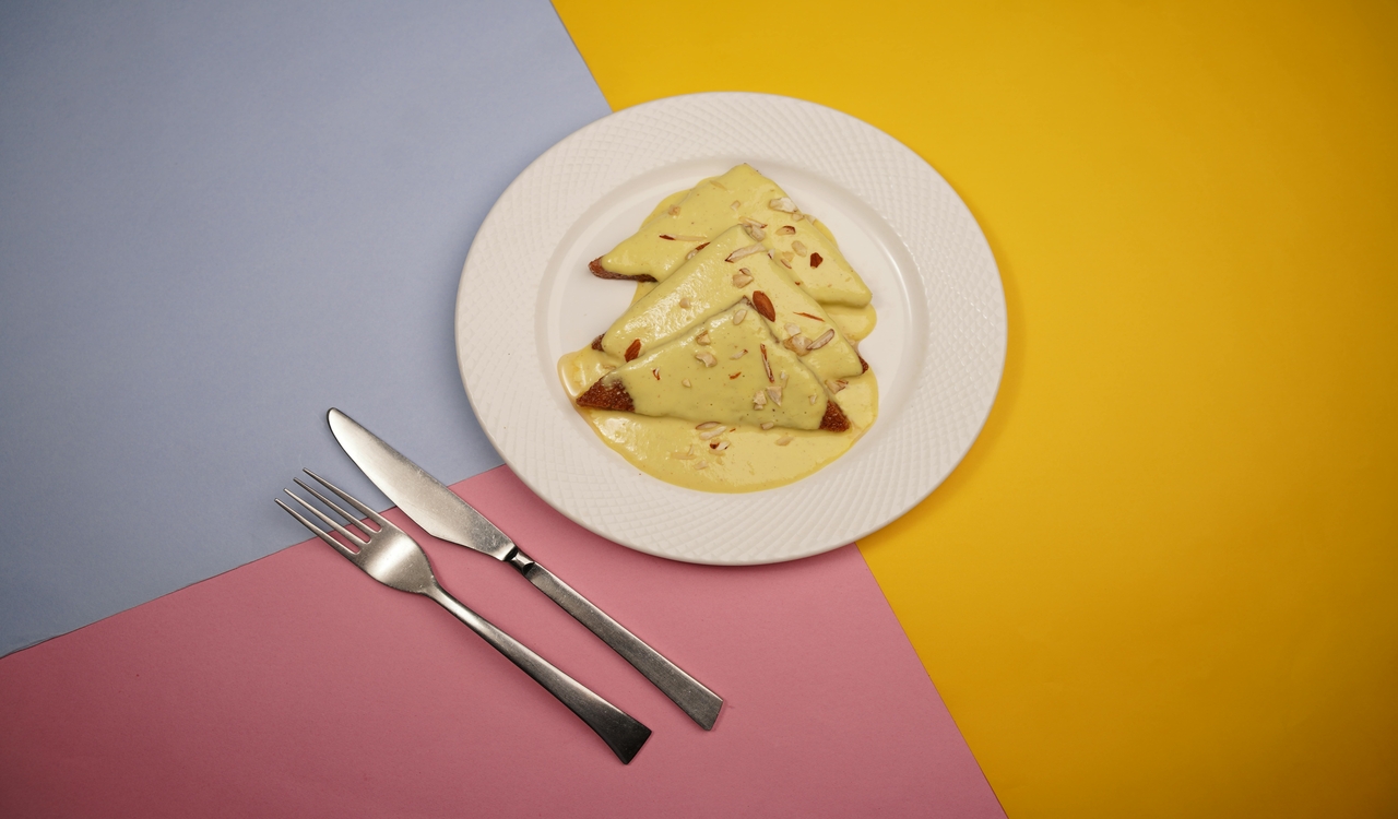 Top View of a Shahi Tukda Dish on a Plate against Colorful Background