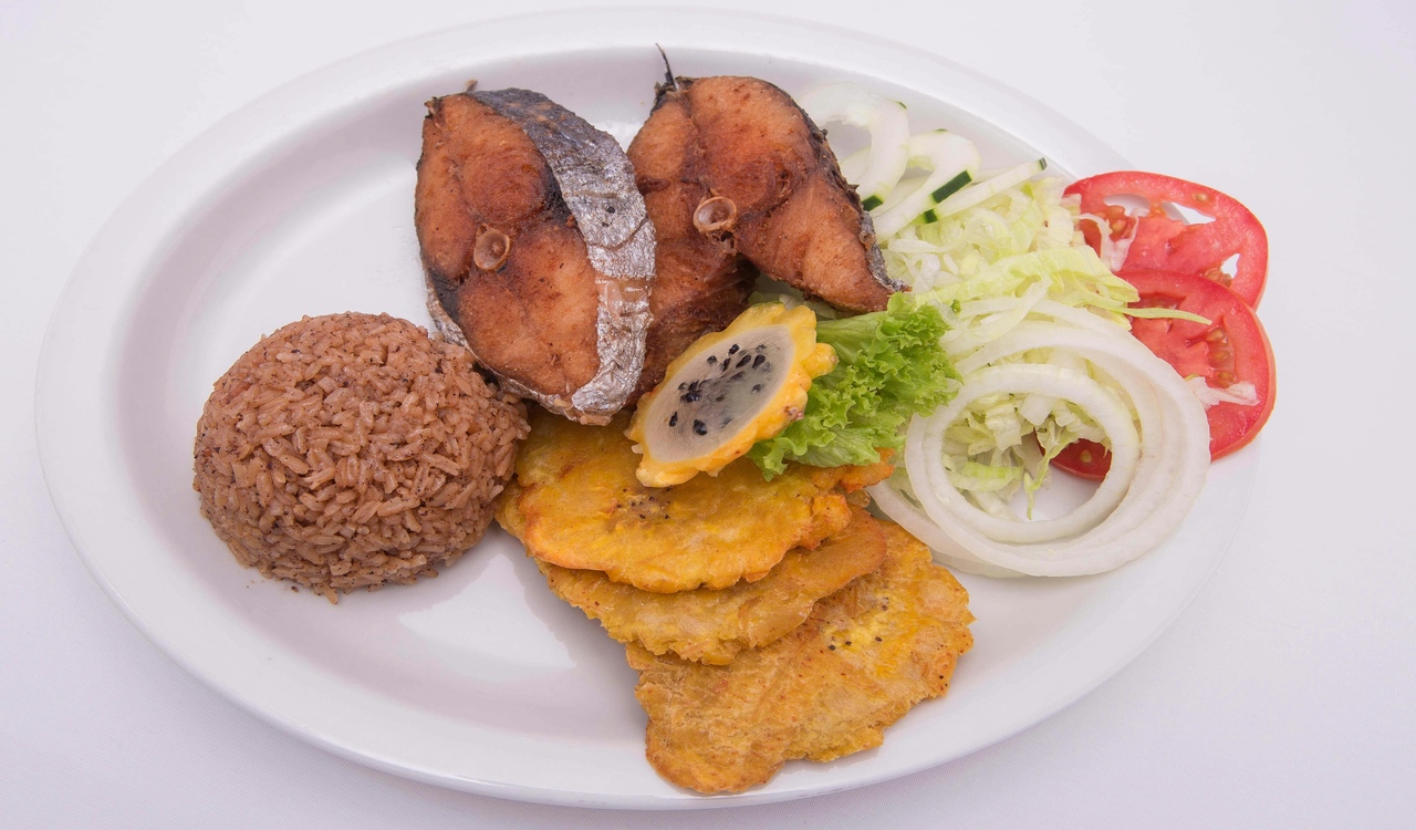 Fried Fish With Vegetable and Brown Rice on White Ceramic Plate