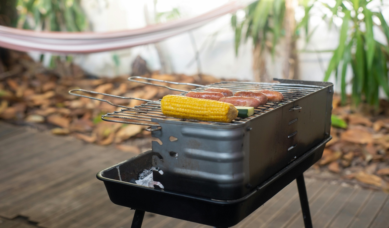 A Corn and Sausages on a Griller