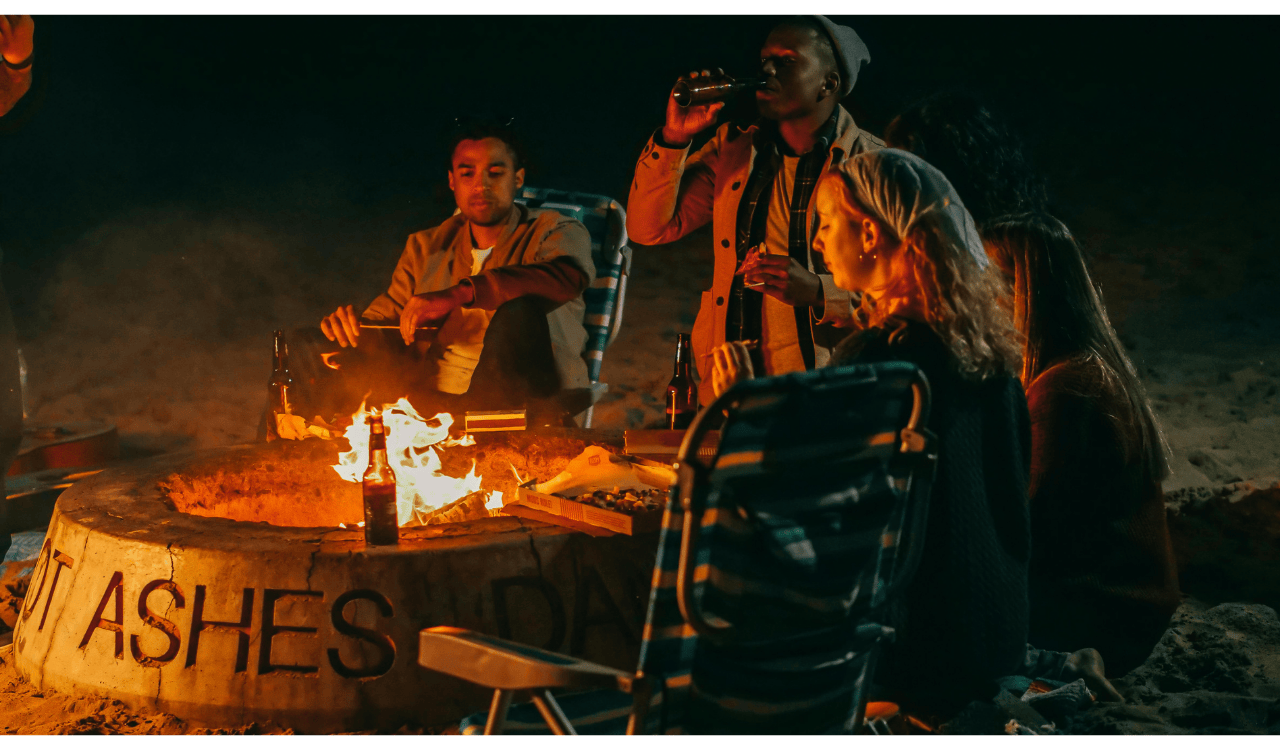 Group of Friends Eating in Front of Fire Pit