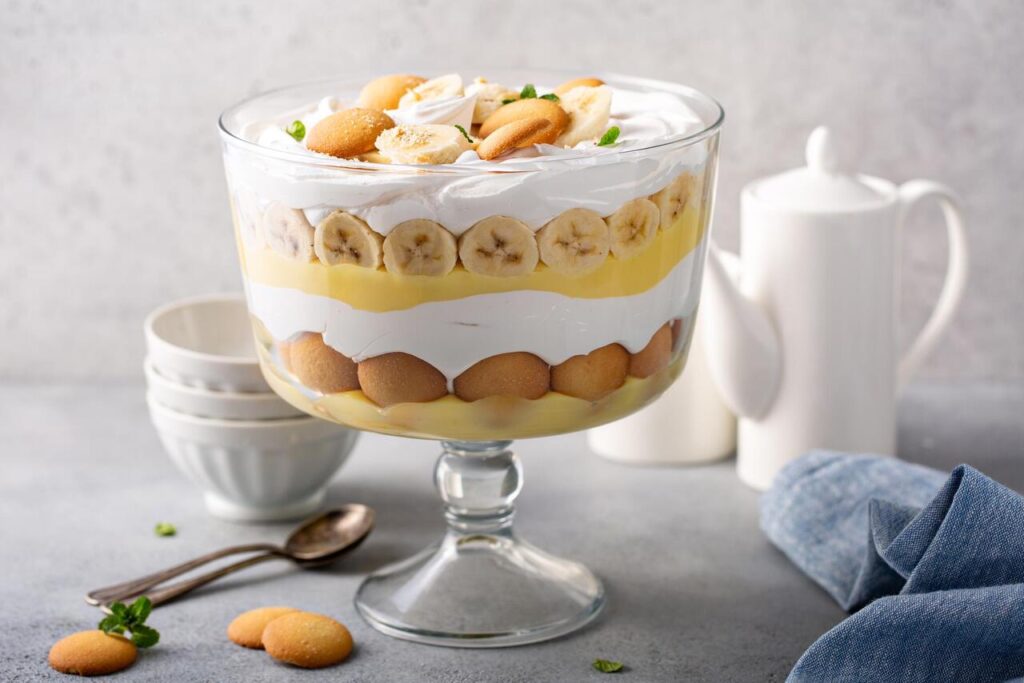 Banana pudding trifle with vanilla wafers in a large digh glass