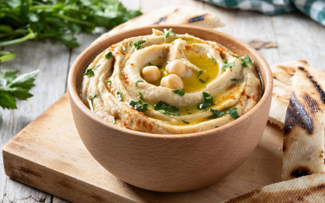 Chickpea hummus on a rustic wooden table