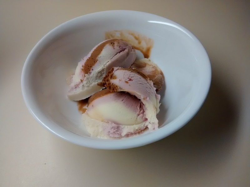 A bowl of So Delicious Dairy Free Neapolitan soy ice cream.