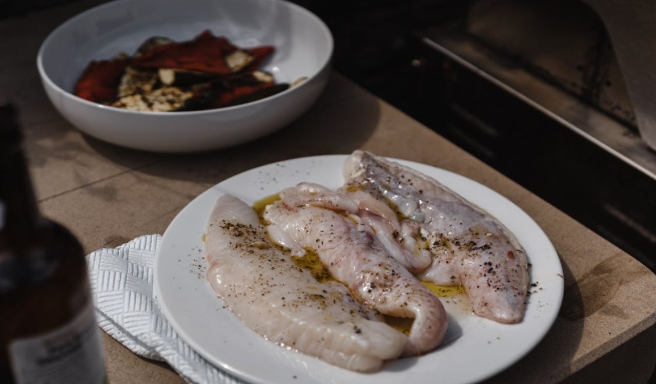 Uncooked fish fillet with spices