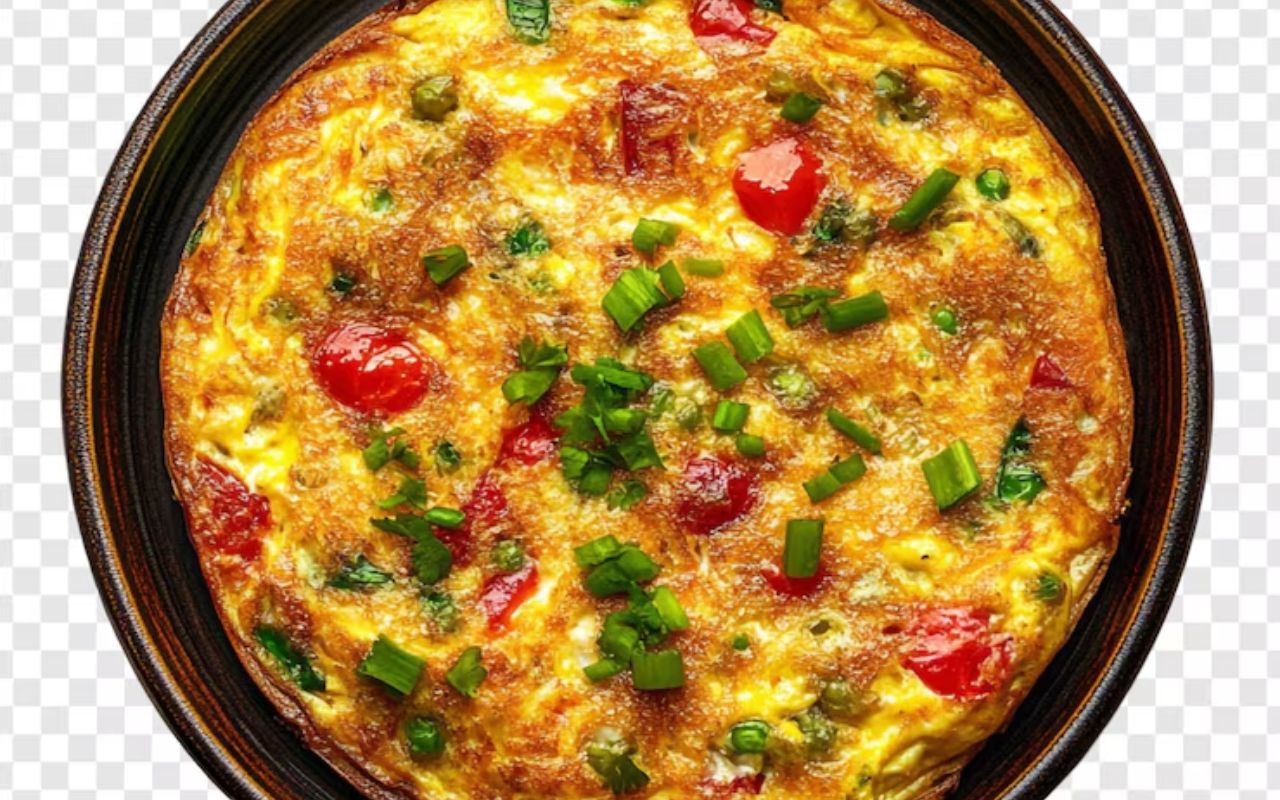 Veggie omelet topped with scallions