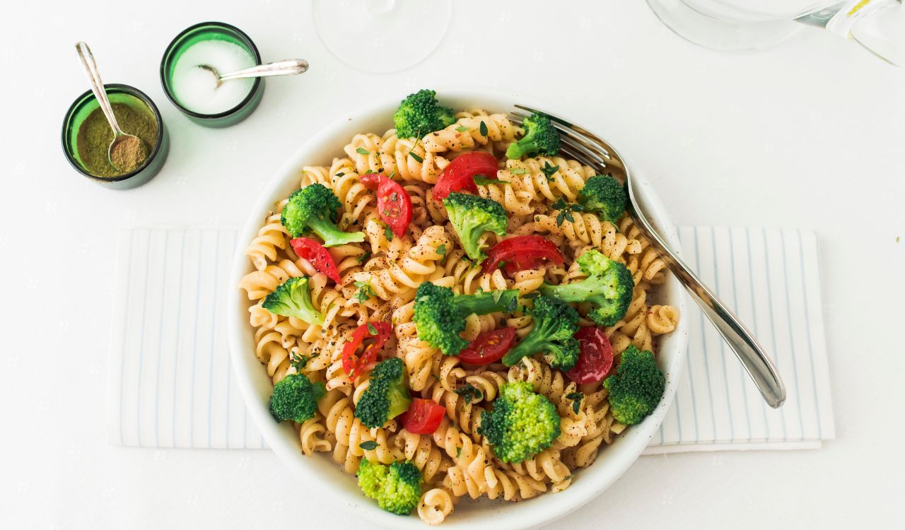 Fusilli pasta salad with tomato and broccoli on napkin