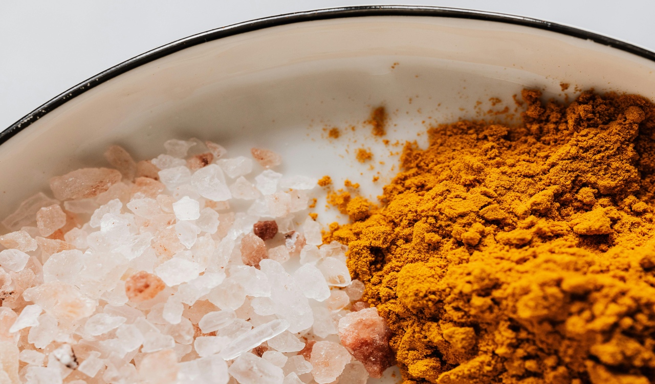 Assorted spices in white metal bowl