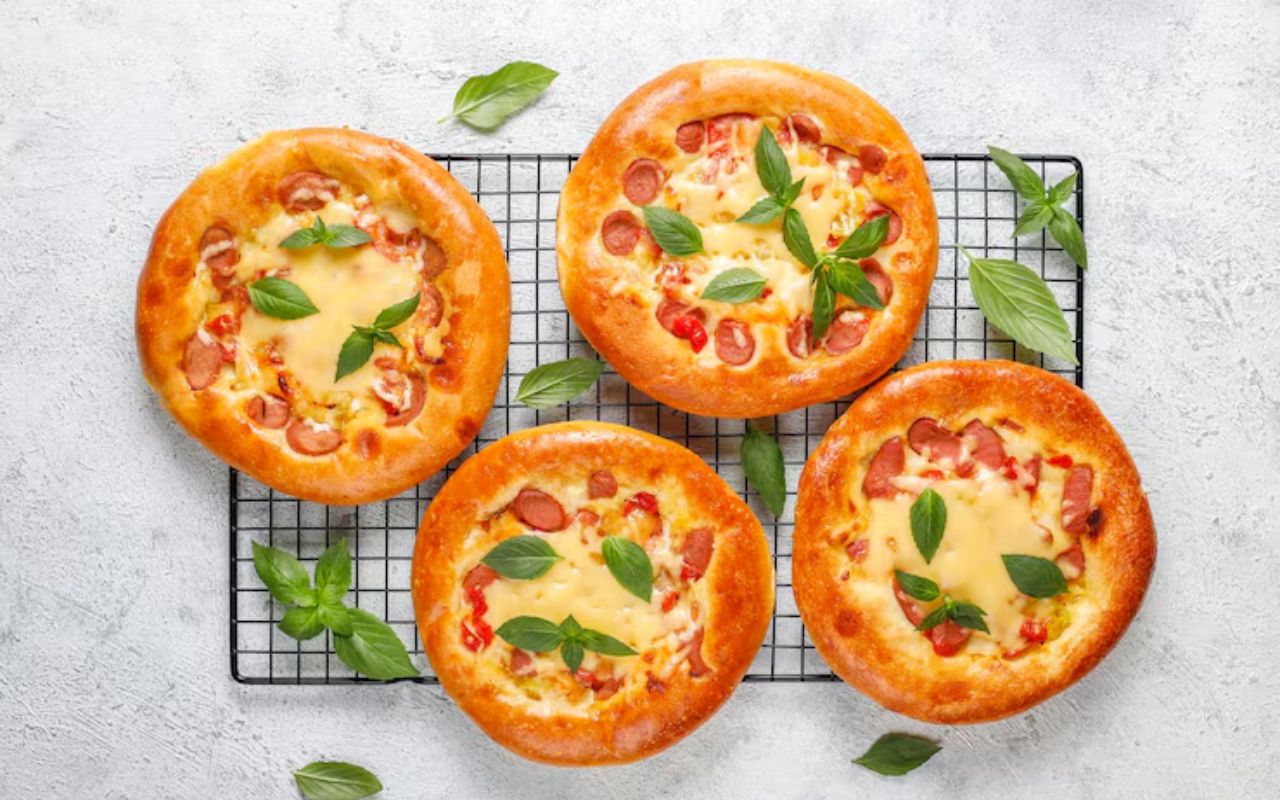 ChatGPT said:Mini pizza muffins topped with cheese, sausage, and basil