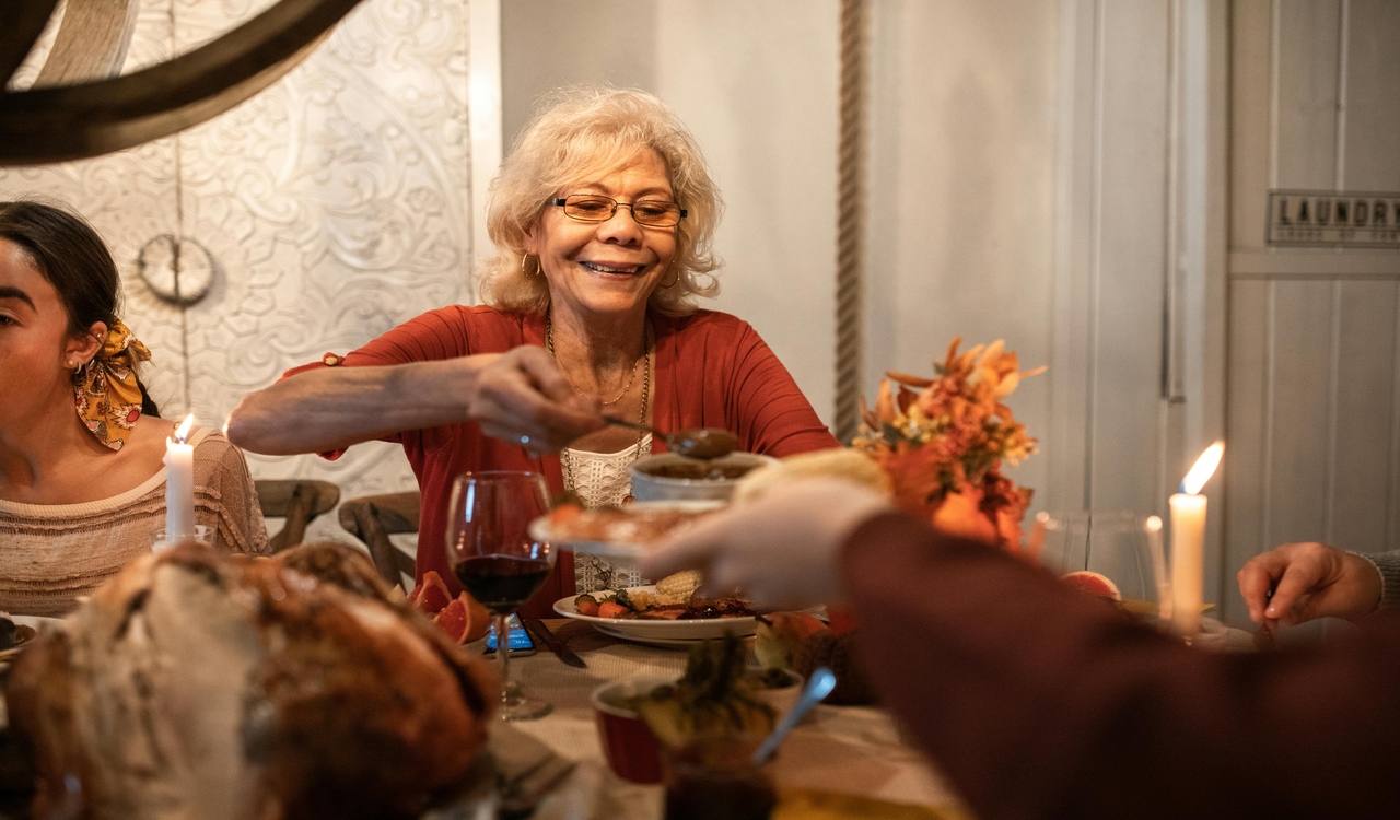old woman serving dinner
