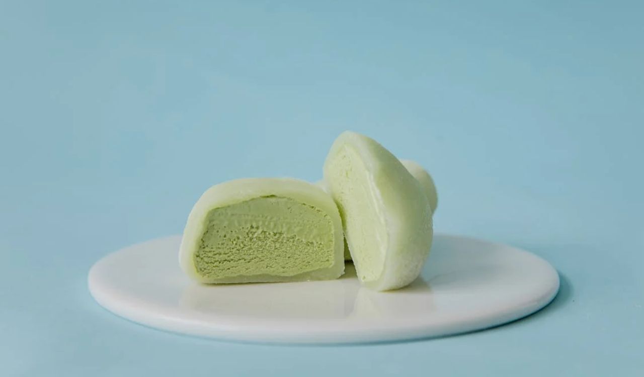 Sliced Green Mochi Ice Cream on White Ceramic Plate
