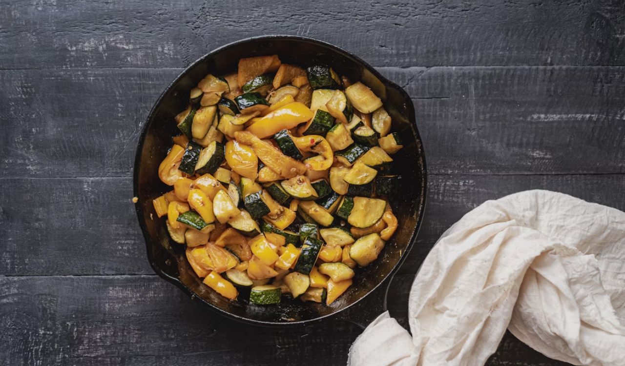 Sliced vegetables on cast iron