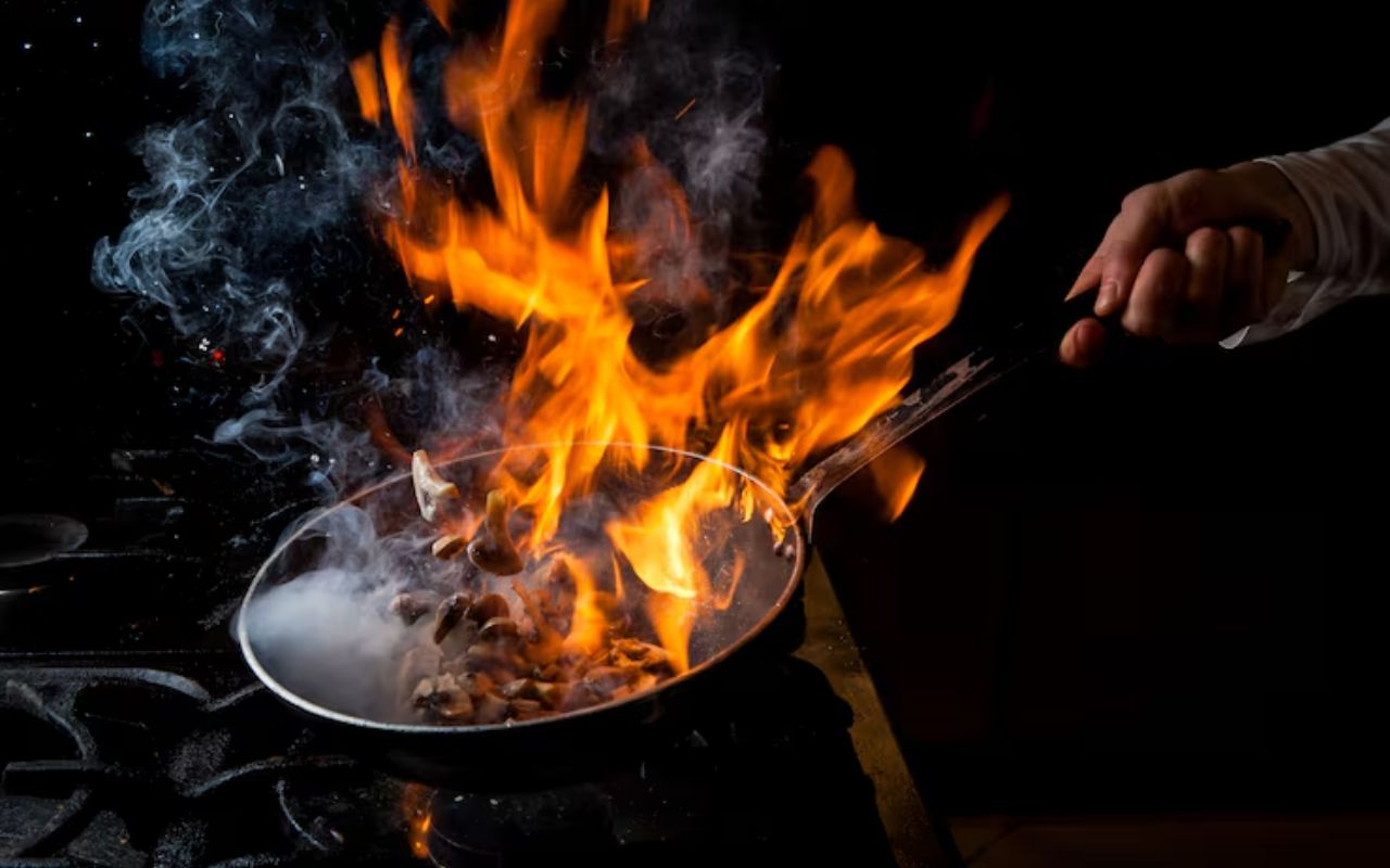 Flaming skillet on stovetop