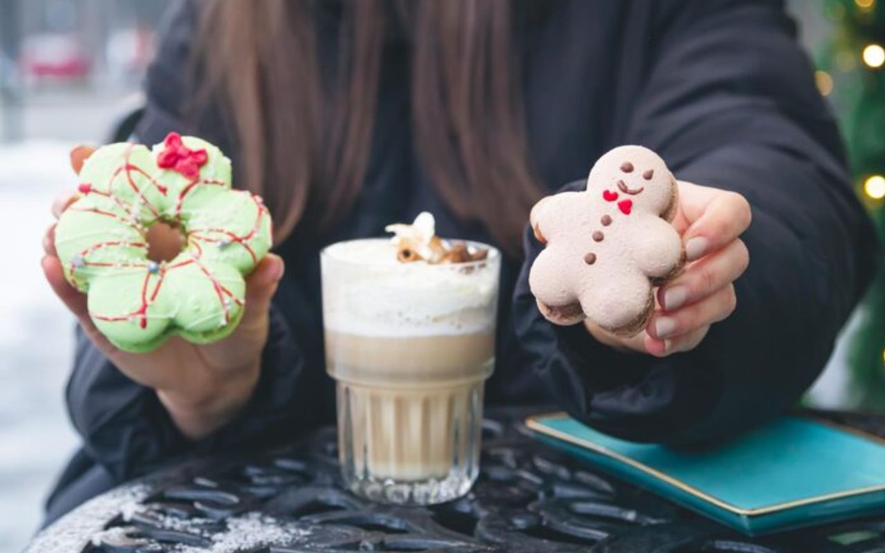 Gingerbread man cookie and wreath donut with latte